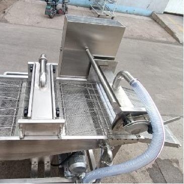 Máquina automática para batir y hornear pescado para el procesamiento térmico en la industria alimentaria
